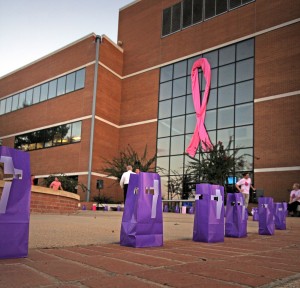 Luminaries line the sidewalk in front of the SAU Business building during the 2013 "Light for the Fight" event.