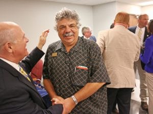 Dr Ed Kardas - Distinguished Professor - congrulated by Dr Trey Berry