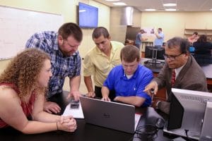 sau-engineering-prof-and-students-in-lab-jpg